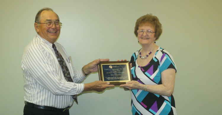 Rich Kern thanks Eileen Rodammer for all the work she's done for the Michigan District